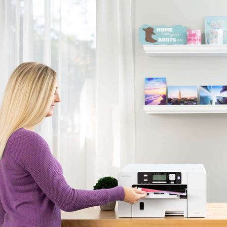 Woman using Sawgrass SG500 Sublimation Printer with Sublijet UHD inks in home office setup